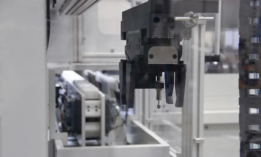 Gripper-and-Conveyor UNISIG automated part gripper and conveyor
